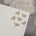 Elegant gold bow-shaped zircon charms for 3D nail art and manicure decoration 9x10mm - Butterfly Bow Style (G1631)