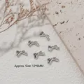 Λαμπερά ασημένια μεταλλικά διακοσμητικά νυχιών σε σχήμα φιόγκου για μανικιούρ 3D - Φιόγκος (G1590) / Συσκευασία 10 Τεμαχίων / Ασημί