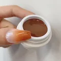 Nail ombre gel polish N.09 in warm brown showing a professional gradient effect on nails - No.09