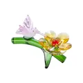 Elegant faceted crystal hummingbird figurine on green branch with a yellow flower - Hummingbird Flower - Golden