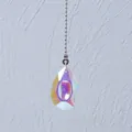 Detail view of a shimmering iridescent AB crystal teardrop pendant with a silver bead chain - 50mm Dragon Eye / 50CM Bead Chain / Multicolor