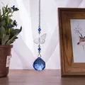 Detailed view of crystal butterfly hanging ornament with blue faceted suncatcher ball - Butterfly Suncatcher / Medium Blue