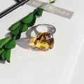 Close-up detail of a silver ring featuring a large faceted bright yellow crystal stone - 20mm Napkin Ring / Yellow
