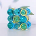 Macro view of blue and yellow translucent crystal spheres stacked in a cube desktop ornament - Colorful Spheres Ornament - Square