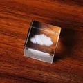 Detail showing 3D laser-engraved cloud inside a transparent crystal cube on wood background. - Cloud / 4x4x4cm