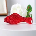 Close-up of translucent red crystal fish figurine with detailed scale texture - 70mm Fish / Red