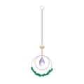 Detail shot of crystal suncatcher with lotus charm and green crushed stones - Deep Green Stone Style