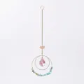 Close-up detail of gold lotus suncatcher featuring blue crushed stones and iridescent teardrop crystal - Mixed Green Stone Style