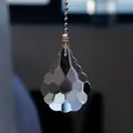 Detailed macro view of a multifaceted teardrop crystal pendant for fan light pulls - 50mm Lily (50cm Chain) / Clear