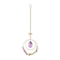 Close-up detail of a purple teardrop crystal suncatcher with gold lotus and stones - Seven Color Stone Style