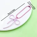 Detailed dimension view of a pink bow keychain measuring 9cm by 3.7cm on a white plate - Baking Varnish Bow Ball Chain (ER2101)