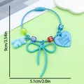 Sweet light blue bow keychain featuring gummy bear and heart charms, 5.1cm width - Painted Bowknot Heart Bear Letter Bead Keychain (ER2110)