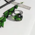 Macro view of large green crystal ring with elegant light refraction and green leaves - 20mm Napkin Ring / Green