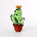 Detailed macro view of a handcrafted green glass cactus ornament with a yellow flower - Cactus with Yellow Flower / 60*106mm