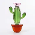 Detailed view of a handcrafted green crystal cactus with a delicate pink flower - Cactus with Pink Flower / 63*107mm