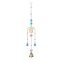 Detailed view of a golden eye suncatcher with blue crystals and a bell. - Eye Bell Style / Lake Blue