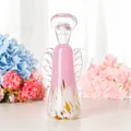 Detailed view of a handmade pink and white glass angel figurine with clear wings - Gold Pink Angel