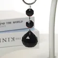 Elegant black faceted crystal waterdrop pendant hanging from two octagonal glass beads - Black Octagonal Bead Pendant / Black