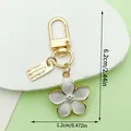 Pearl white cherry blossom flower keychain with gold clasp and dimension markings - Cherry Blossom Style (LS526) / White
