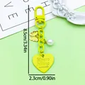 Vibrant yellow zinc alloy keychain with heart, butterfly, and pearl charms, SKU detail. - Baking Varnish Heart U-Shaped Clasp (ER2105) / Yellow