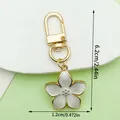 Elegant pearlescent white cherry blossom flower keychain with gold-tone hardware - Pearly Cherry Style (LS521) / 5.4g/6.2cm / White