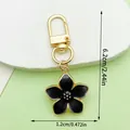 Elegant black enamel cherry blossom keychain with gold-tone lobster clasp and size markings - Pearly Cherry Style (LS523)