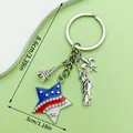 US flag star keychain with Statue of Liberty and Eiffel Tower charms in silver finish. - Rhinestone Star Tower Style (ER1653)