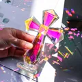 Close-up of a multifaceted iridescent crystal cross ornament showing rainbow light - Cross Ornament / 100*150mm / AB Color