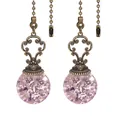 Vintage bronze fan pull chain featuring a pink ice-crackle crystal ball pendant. - Pink