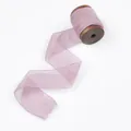 Elegant lavender frayed edge chiffon silk ribbon on wooden spool for DIY crafts. - Lavender