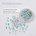 Elegantes blaues Nagelkunst-Set mit Strasssteinen und Stahlkugeln für Maniküre - Herz des Ozeans