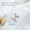Luxurious gold-tone nail art accessories with sparkling zircon and pearl accents style G405 - Gold V-shape Pearl Bowknot (g405) / 1 Piece (11*6mm)