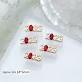 Charmes d'art d'ongle 2023 avec zircon rouge et finition dorée - Style Numéro Strass Rouge Doré (G-1186) / 1 Pièce