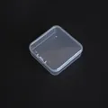 Detailed top-down view of a small 6.5cm square transparent PP plastic storage box. - 6.5*6.5*2cm / Clear