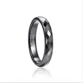 Macro view of a faceted black tungsten carbide ring, 4mm width, showing inner engraving. - Size 6 / Black