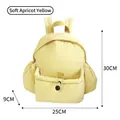 Soft apricot yellow minimalist travel backpack with marked 30x25x9cm dimensions - 30x25x9cm / Apricot Yellow