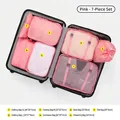 7-piece pink travel luggage organizer set with various bag sizes for clothes and shoes - Pink