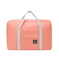 Coral pink travel duffel bag with grey handles and luggage sleeve for suitcase attachment - Pink