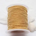 Detailed macro view of 14K gold-filled bead chain on a spool for DIY jewelry making. - 1.2 Ball Chain / 18K Gold
