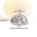 Detailed macro shot of an antique silver plum blossom fan pendant for jewelry DIY projects - Antique Plum Blossom Fan (GF-471 Style 3) / Approx. 20.5x24mm