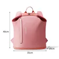 Pink waterproof gym backpack for swimming and travel with 40x35x18cm dimension labels. - Pink
