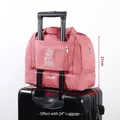 Small wine red waterproof travel bag with suitcase sleeve and double layer storage - S / Burgundy