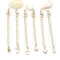 Detalle de seis cadenas de extensión chapadas en oro con varios dijes y cierres de langosta - Cadena de Extensión con Colgante de Bola / Cierre de Langosta 10mm / Chapado en oro 14K