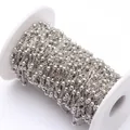 Close-up of 3.5mm silver satellite ball chain on a white spool for jewelry making - 3.5MM Bead Chain / White Gold
