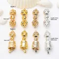 Detailed view of assorted gold and silver Vajra pestle and bell pendants for DIY jewelry - Model 1 Vajra Pestle (GF-180) / Antique Gold
