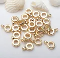 Close-up macro detail of 18K gold plated round ring charms for DIY jewelry making findings - Small Diameter 3.8mm / 14K Color Retention