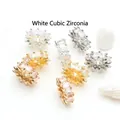 Macro detail of 14K gold plated wheel spacer beads with sparkling white zirconia stones - Wheel Spacer / Large 12mm (14K Gold Tone) / White