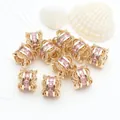 Detailed close-up of 14K gold-plated barrel beads with micro-set pink zircon stones - Pink Zirconia (GF-464) / 14K Gold