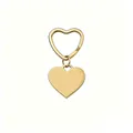Polished gold stainless steel heart-shaped keychain with matching heart ring pendant. - Gold
