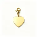 Close-up of a polished gold heart pendant with a secure lobster clasp attachment. - 18K Gold Plated